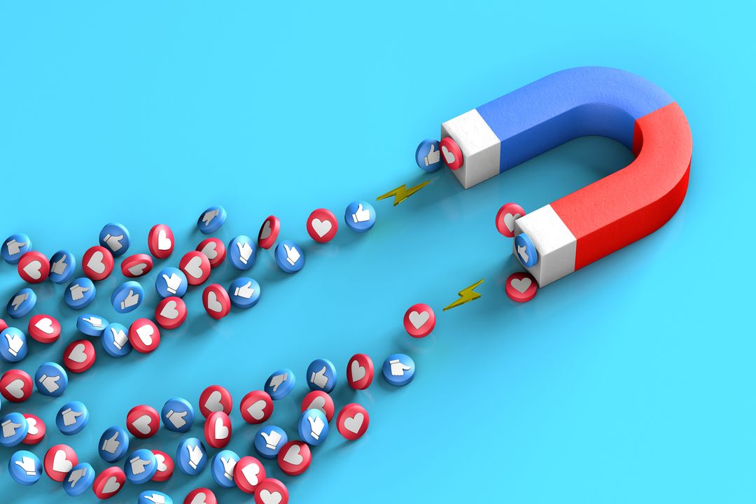Imã puxando likes e curtidas do Facebook e Instragam para representar a importancia de diminuir o custo por lead.